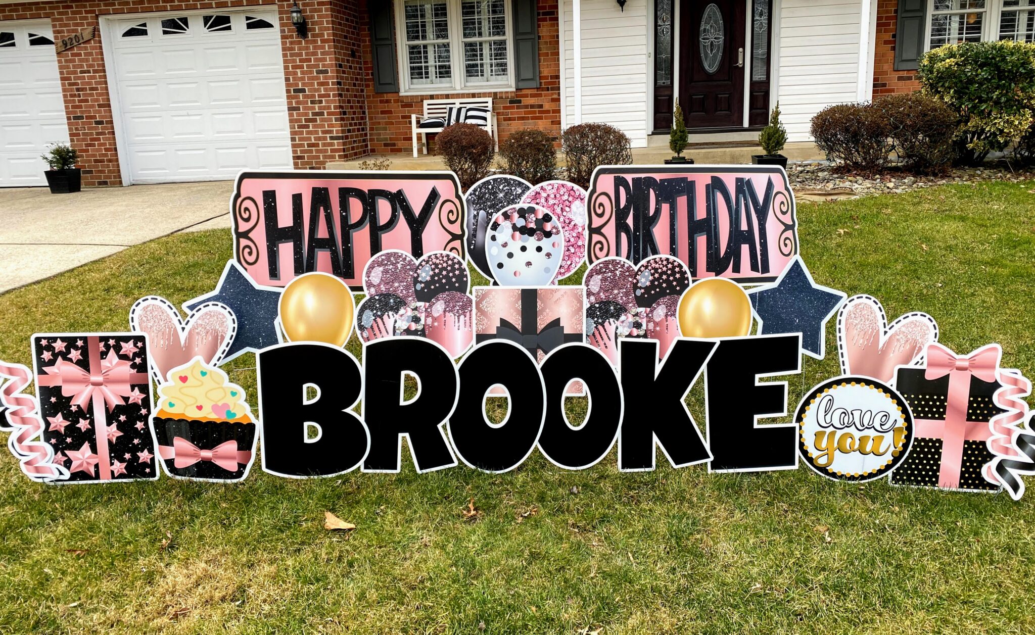a happy birthday yard sign on a front lawn in Bowie, MD